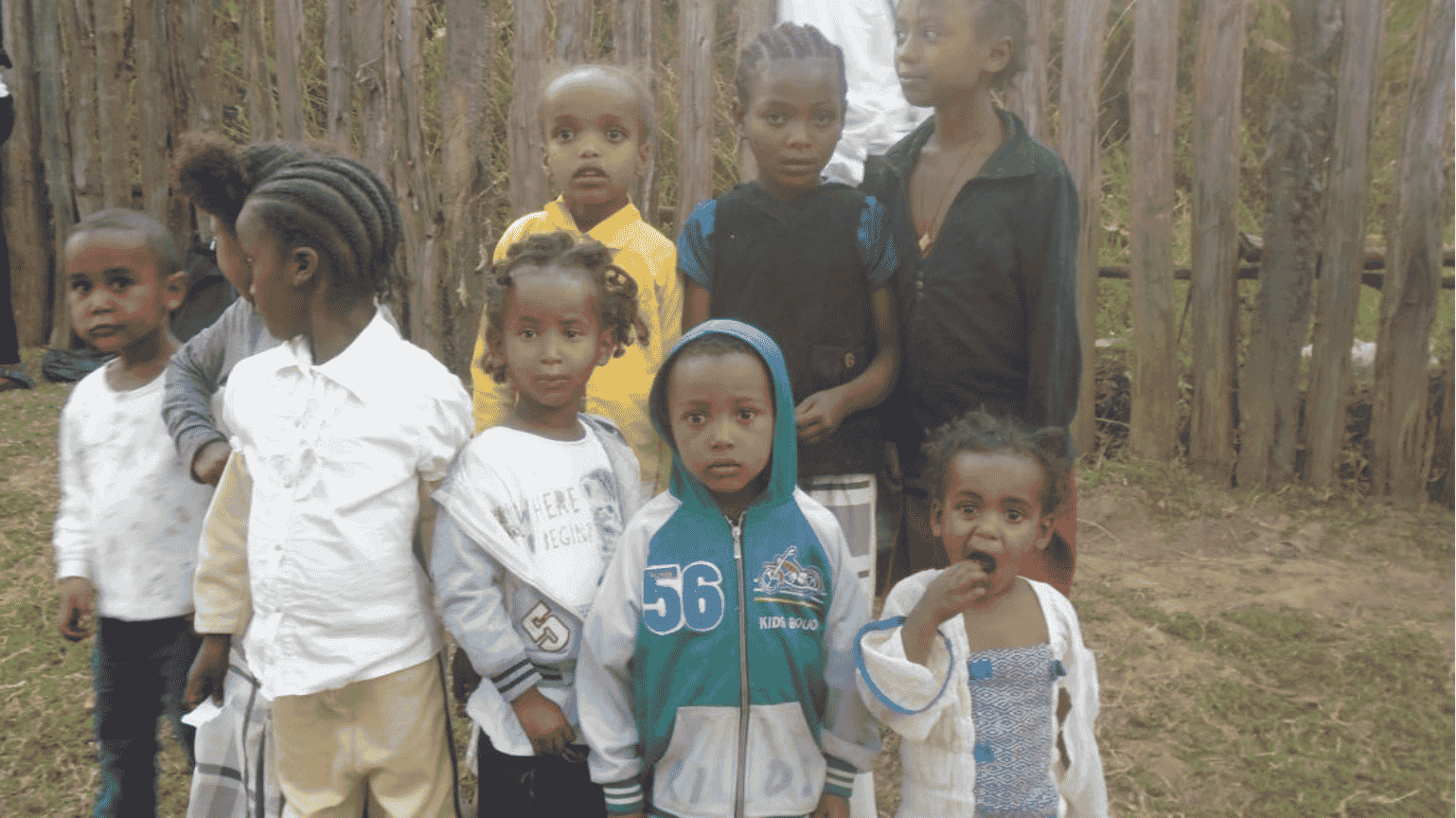 Children sharing meals together, strengthening bonds with the community